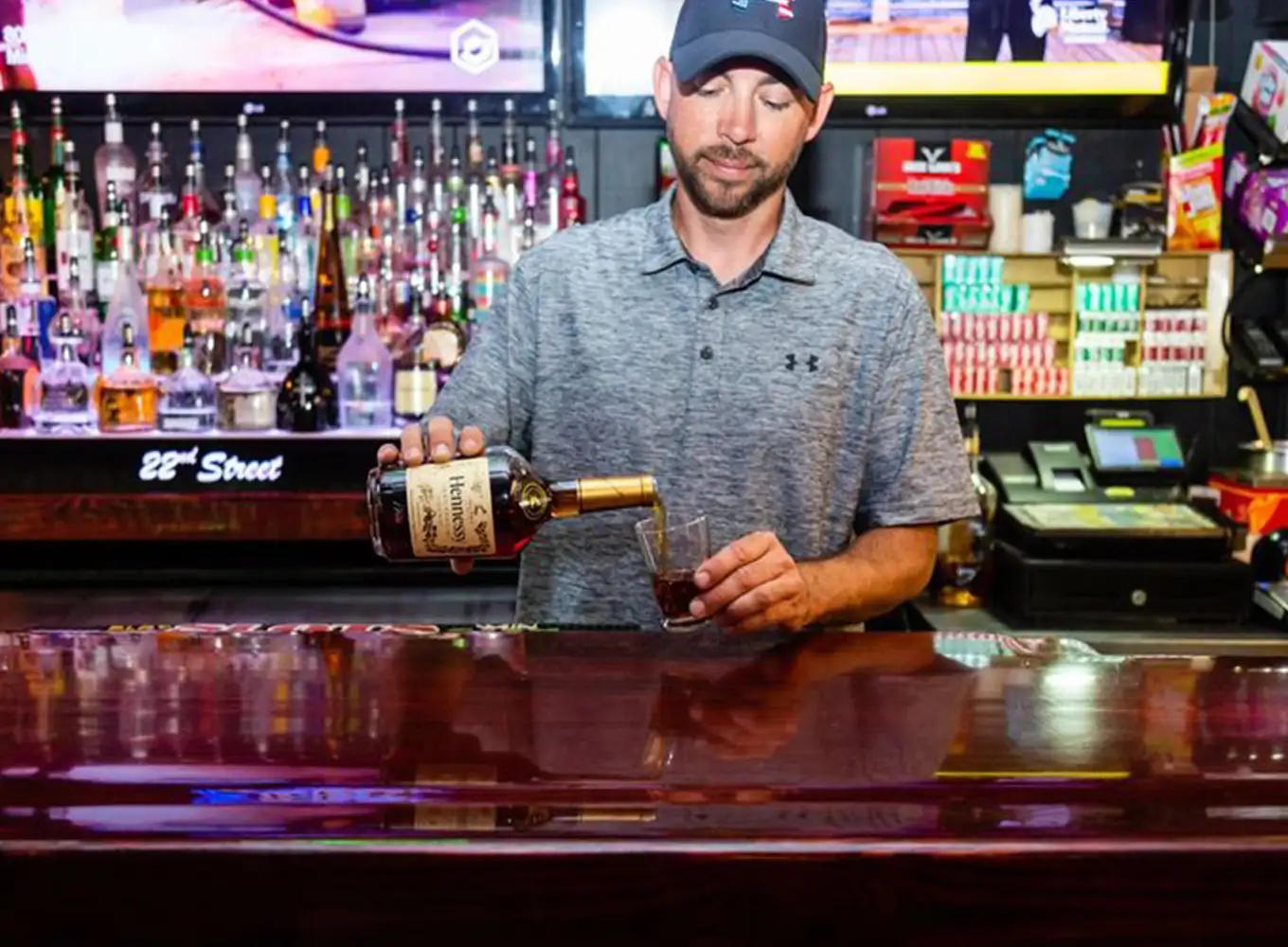 bartender pouring a drink at a decatur il bar